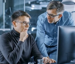 Engineers discussing correlation testing