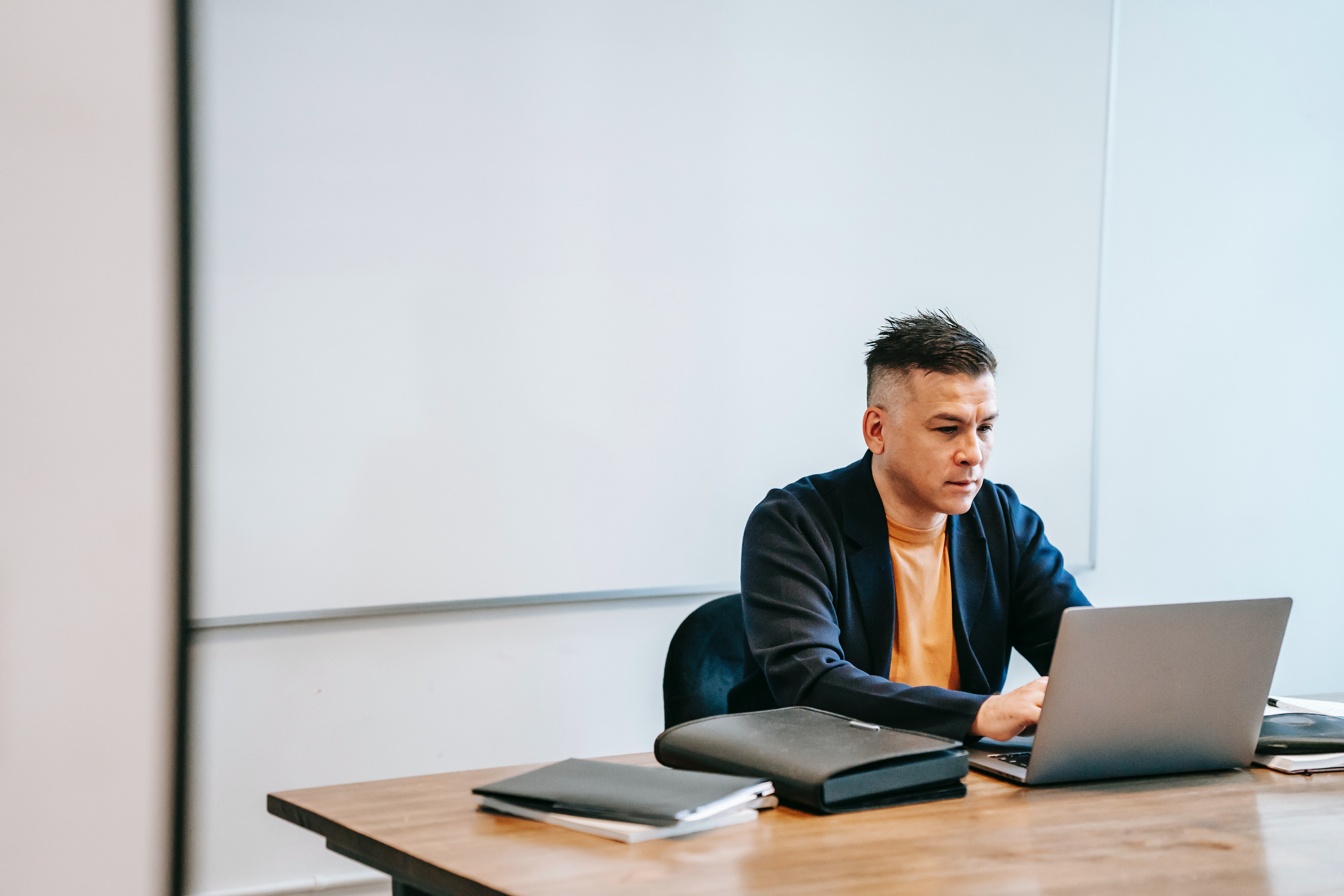 Office employee on laptop for solution to problem Office employee on laptop for solution to problem